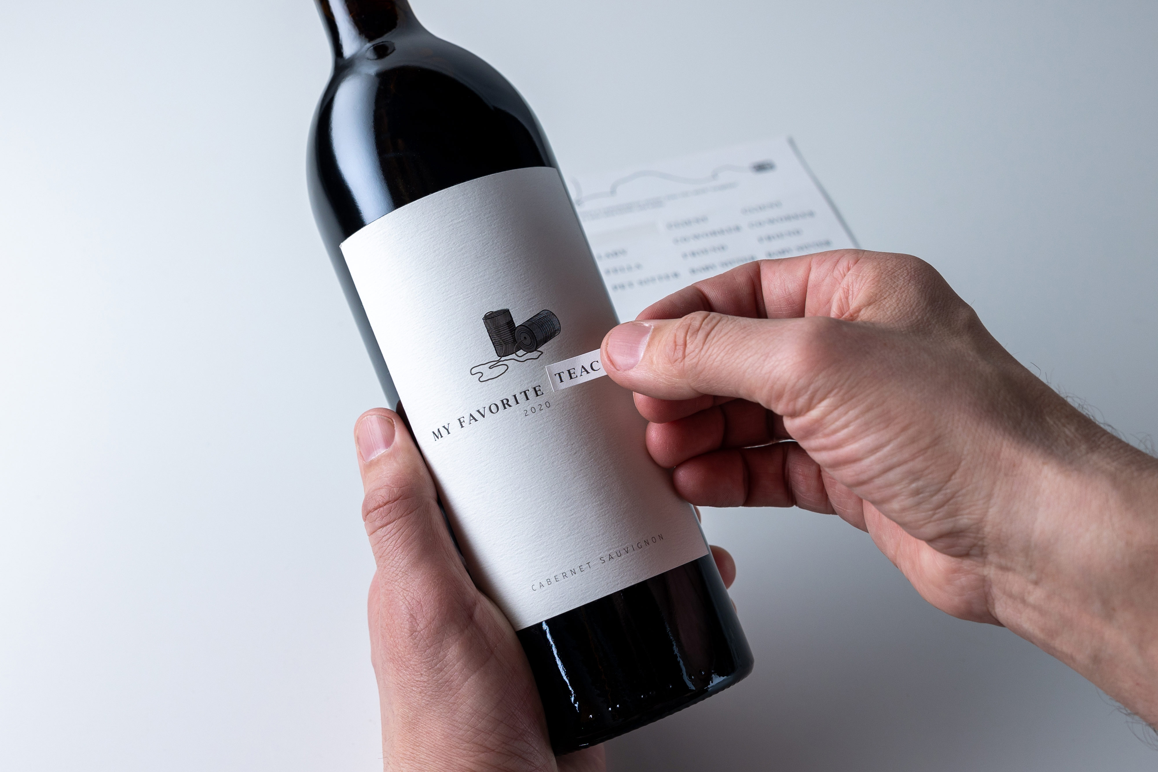 Bottle of MFN Cabernet being personalized